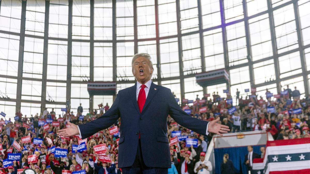 Republican presidential nominee and former President Donald Trump takes the stage during a rally at Dorton Arena in Raleigh on Monday, Nov. 4, 2024, one day before Election Day.