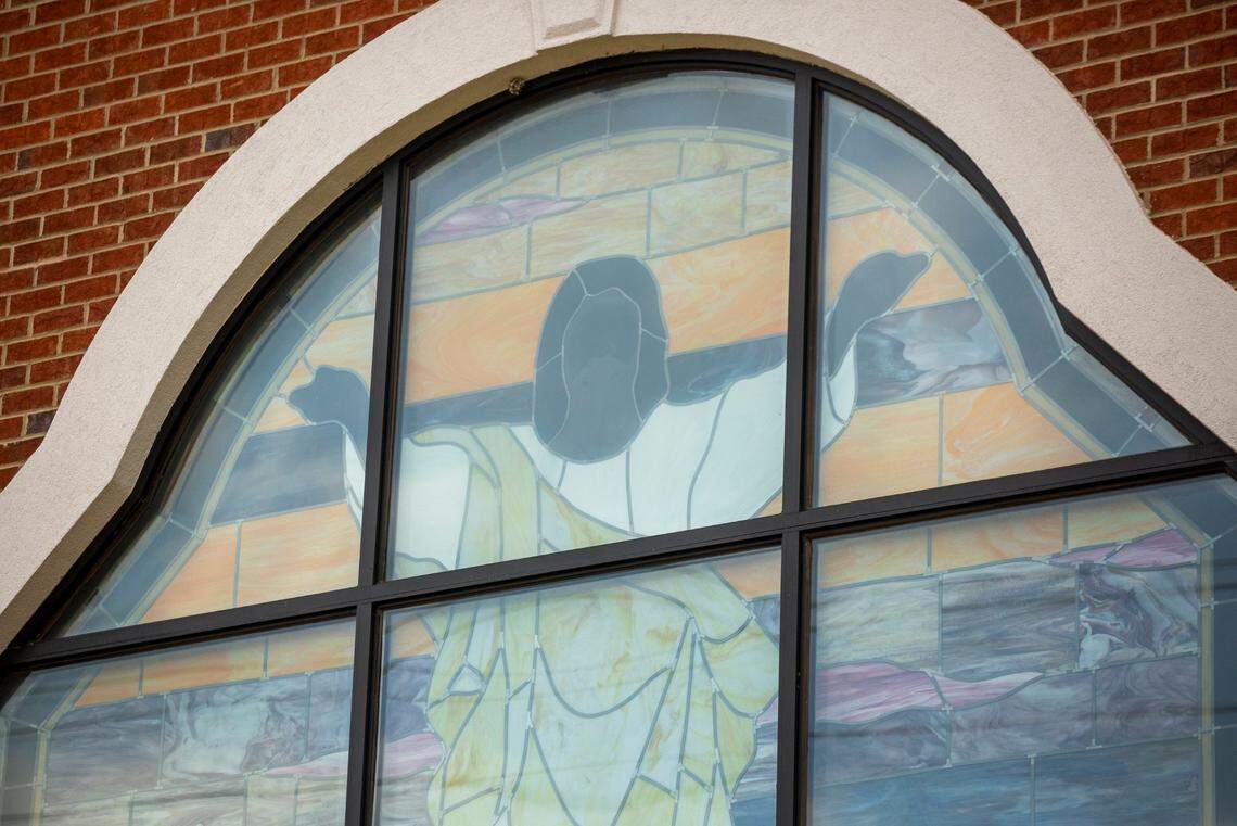 A stained glass window depicting Jesus lets light into the sanctuary of Oak City Baptist Church which was established the Oak Grove Cemetery, in the early 1870s in what was one of five villages created by freed African-Americans after the Civil War, and now has lost more of its tree buffer to widening of the I-440 Beltline, that separated it from the rest of the Method community in the 1960s, on Tuesday, May 11, 2021, in Raleigh, N.C.
