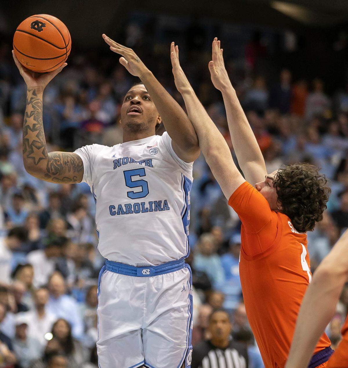 North Carolina’s Armando Bacot (5) puts up a shot against Clemson’s Ian Schieffelin (4) in the second half on Saturday, February 11, 2023 at the Smith Center in Chapel Hill , N.C. Bacot scored 19 points in the Tar Heels’ 91-71 victory.