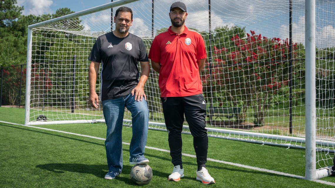 Ramón Gallardo Sr. and Ramon Gallardo Jr., the founders of La Liga Del Sol, pose for a portrait at WRAL Soccer Park in Raleigh on August 2, 2024.