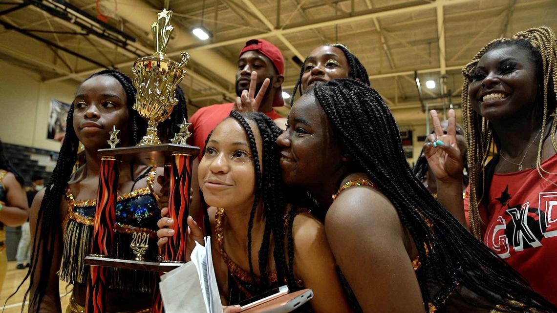 Members of the junior Golden Xplosion dance team celebrate after winning first place in the junior category at a majorette competition held in Smithfield, N.C., on August 14, 2021. It was their first-ever appearance at a majorette competition.