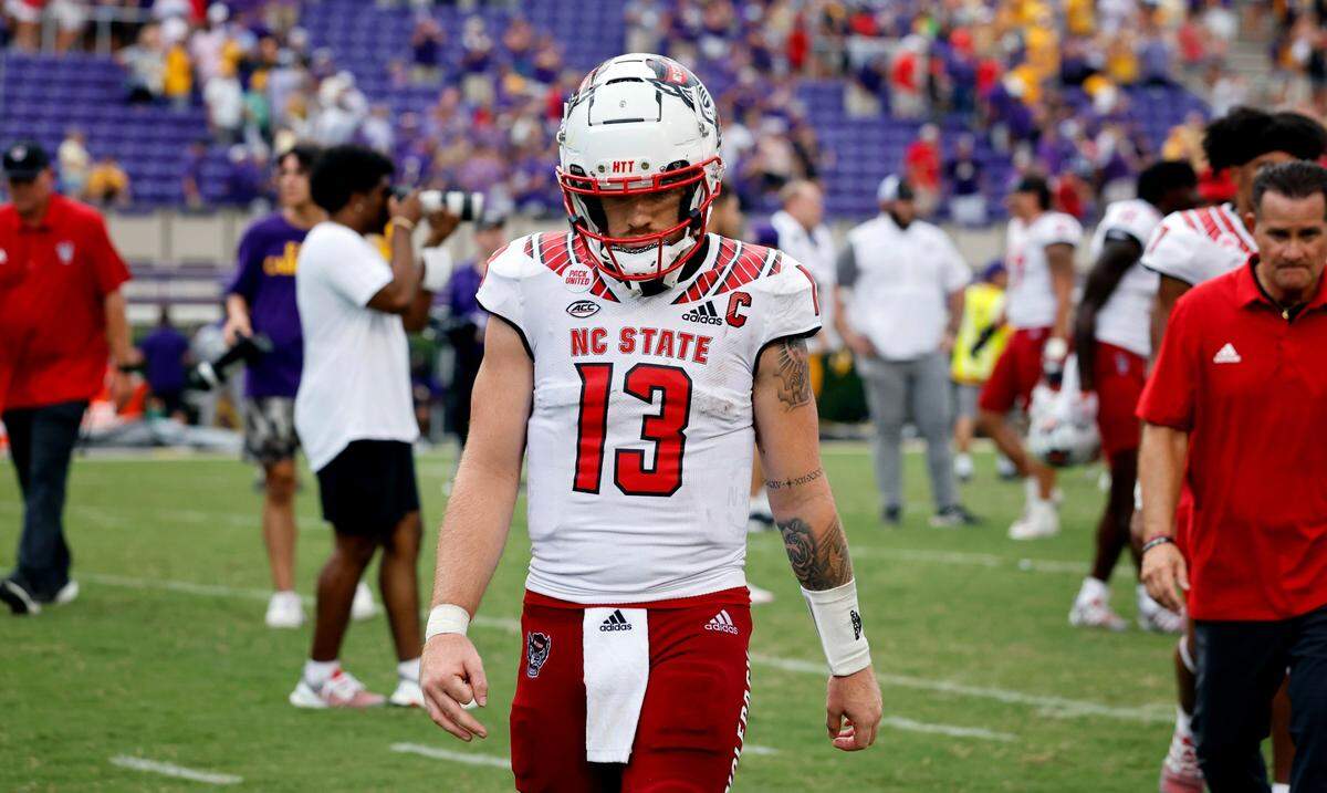 N.C. State quarterback Devin Leary (13) walks off the field after N.C. Stateís 21-20 victory over ECU at Dowdy-Ficklen Stadium in Greenville, N.C., Saturday, Sept. 3, 2022.