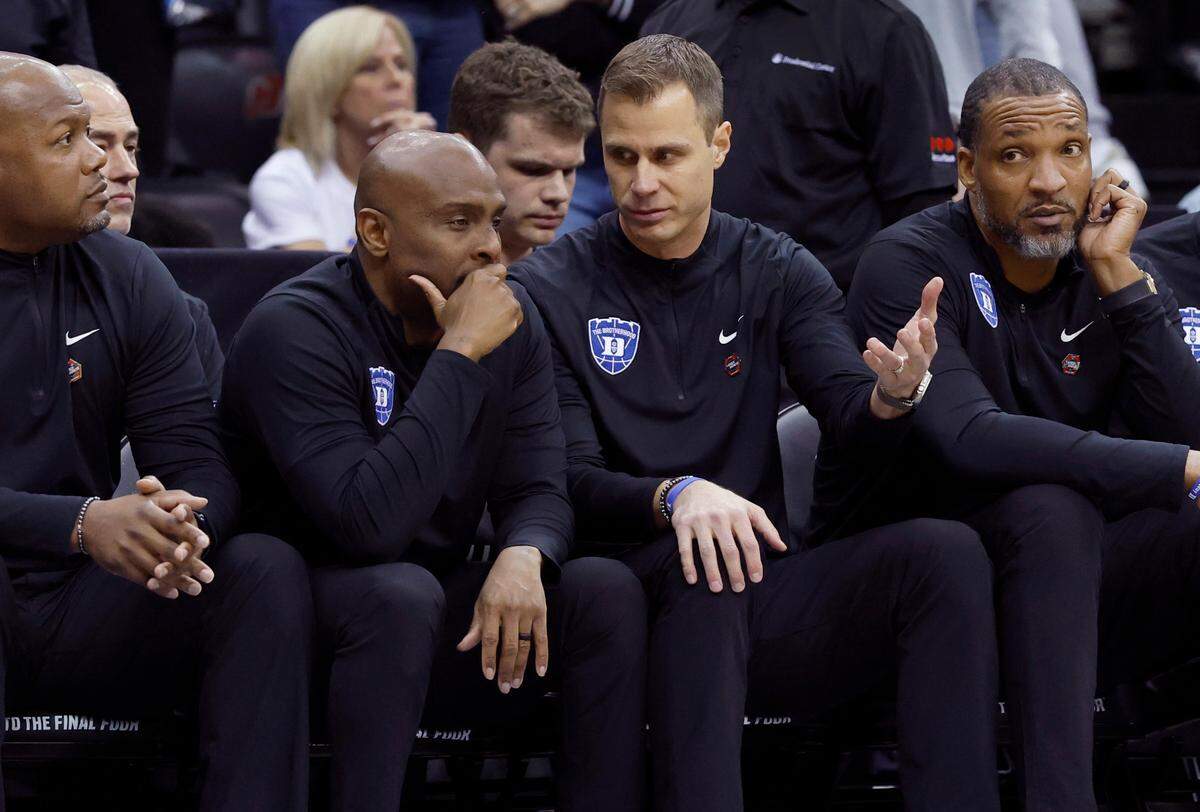 Duke head coach Jon Scheyer talks with assistant coach Emanuel Dildy during the second half of Duke’s 100-93 victory over Arizona in the Sweet 16 round of the 2025 Men’s NCAA Basketball Championship at the Prudential Center in Newark, N.J., Thursday, March 27, 2025.