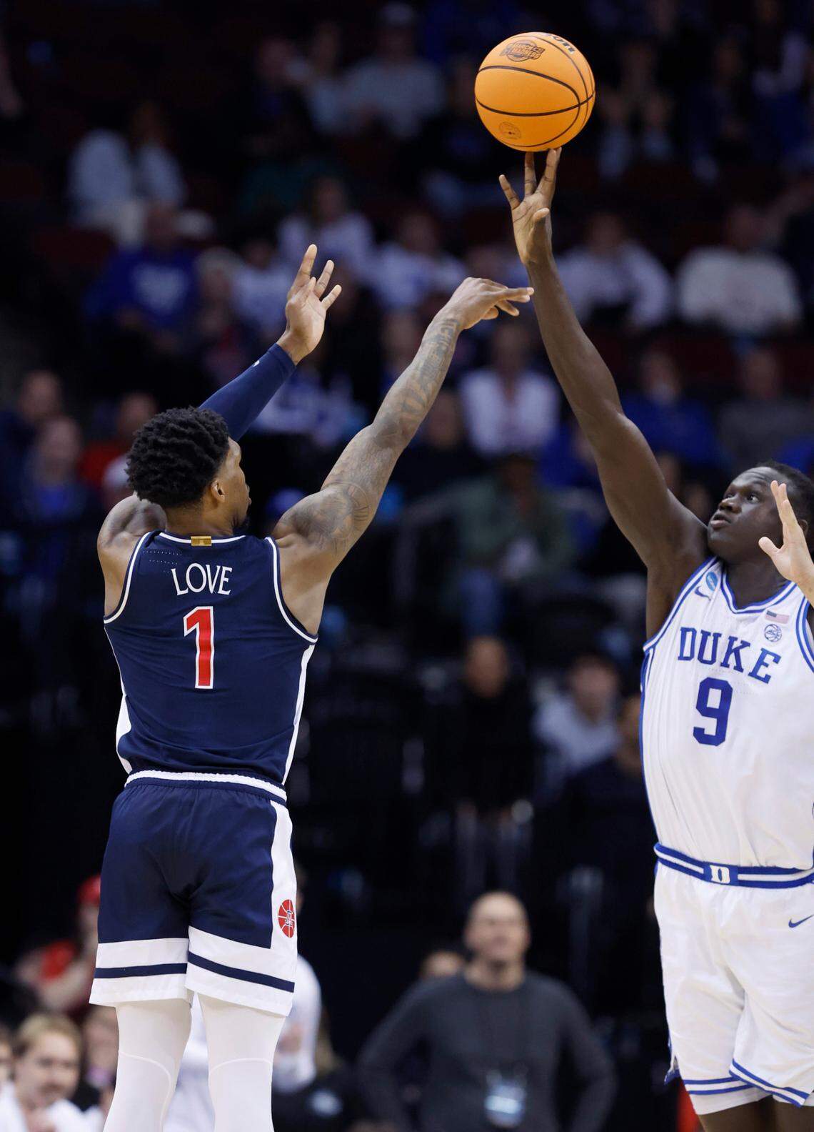 Duke’s Khaman Maluach (9) blocks the shot by Arizona’s Caleb Love (1) late in the second half of Duke’s 100-93 victory over Arizona in the Sweet 16 round of the 2025 Men’s NCAA Basketball Championship at the Prudential Center in Newark, N.J., Thursday, March 27, 2025.