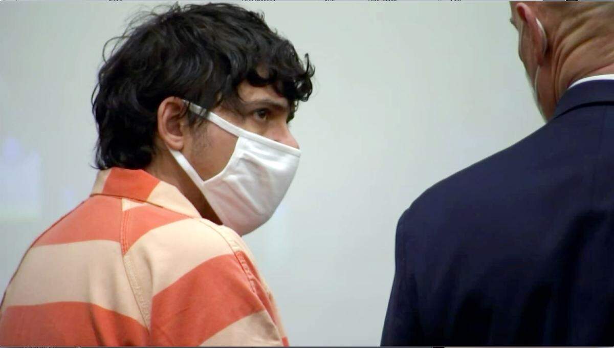 Thomas Clayton Johnson looks at his attorney during his first appearance in Wake County court Thursday, Feb. 11, 2021. Johnson and Emmalei Grace Trevathan have been charged in the murder of Brittany Smith and her unborn child.