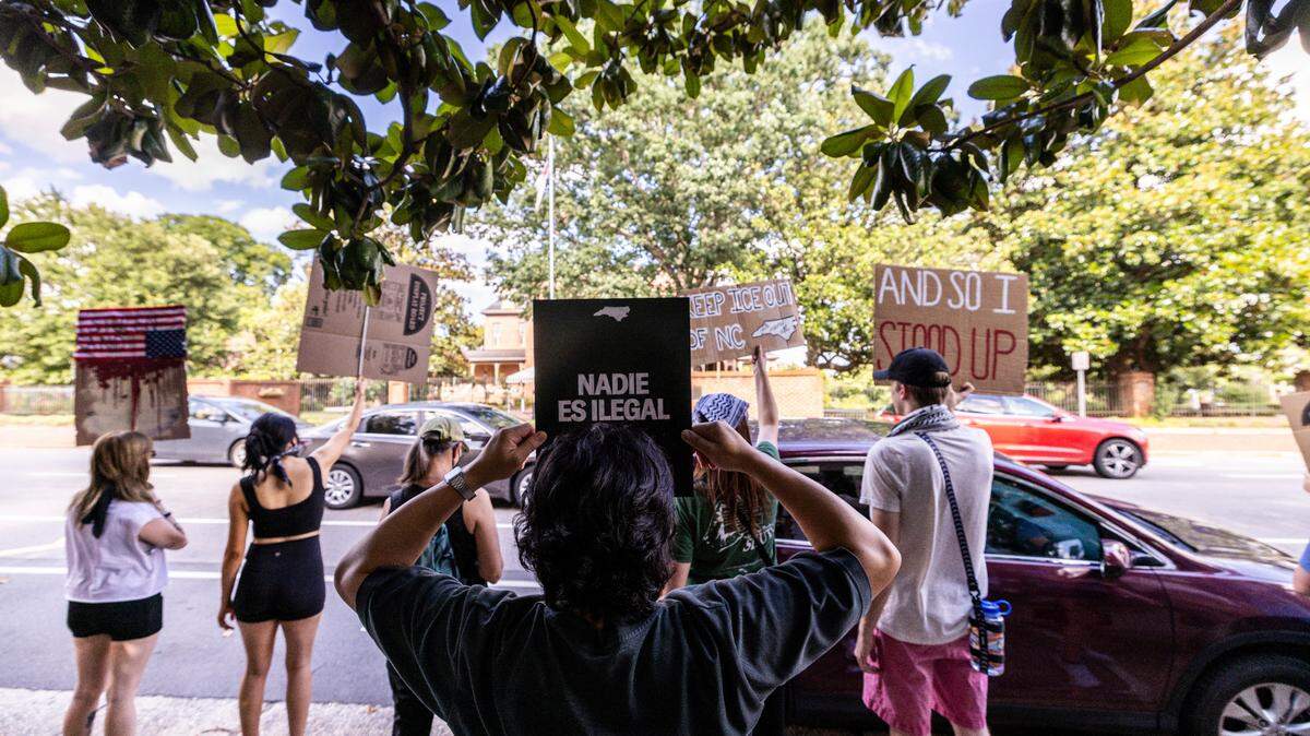 More than 100 demonstrators rallied outside the Executive Mansion in downtown Raleigh on Wednesday, June 18, 2025, urging Gov. Josh Stein to veto two GOP-backed bills that would expand state and local law enforcement cooperation with U.S. Immigration and Customs Enforcement.
