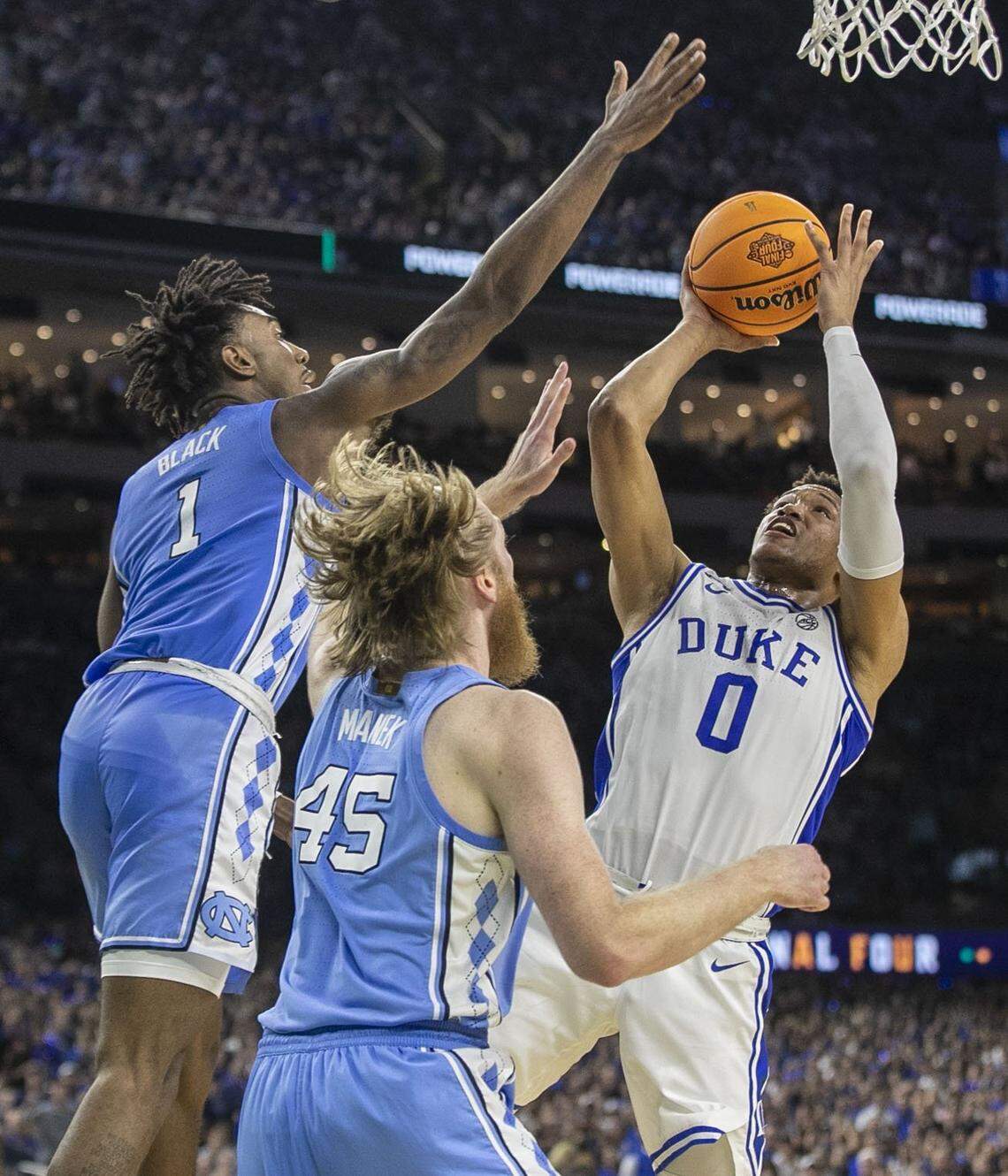 North Carolinas Brady Manek (45) and Leaky Black (1) defend Dukes Wendell Moore Jr. (0) in the first half during the NCAA Final Four semi-final on Saturday, April 2, 2022 at Caesars Superdome in New Orleans, La.
