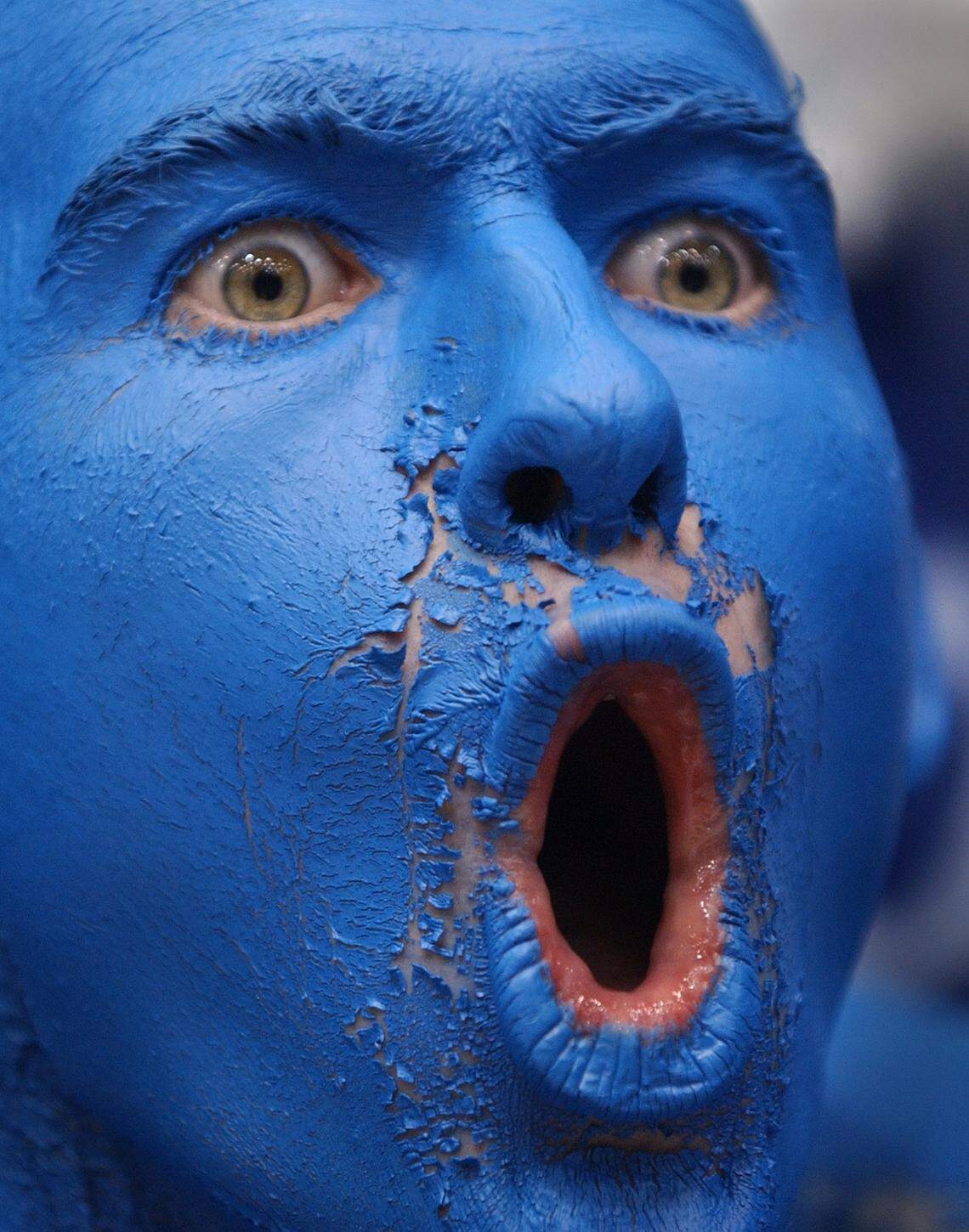 A Duke fan cheers on the Blue Devils. The Tar Heels & Blue Devils are playing in the NCAA tournament for the first time, and it's going to be stressful.