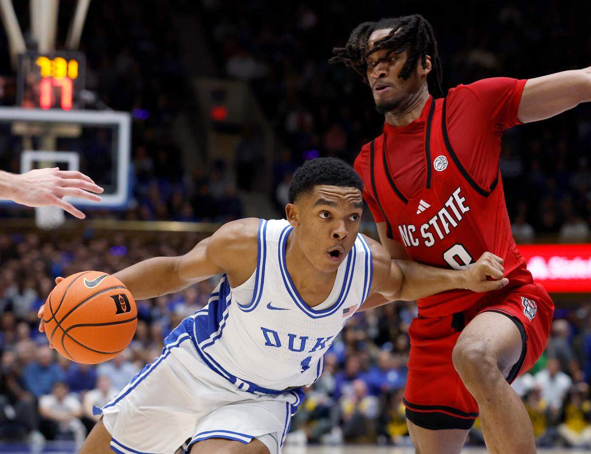 Duke’s Caleb Foster drives past N.C. State’s Jayden Taylor during the first half of the Blue Devils’ game on Monday, Jan. 27, 2025, at Cameron Indoor Stadium in Durham, N.C.