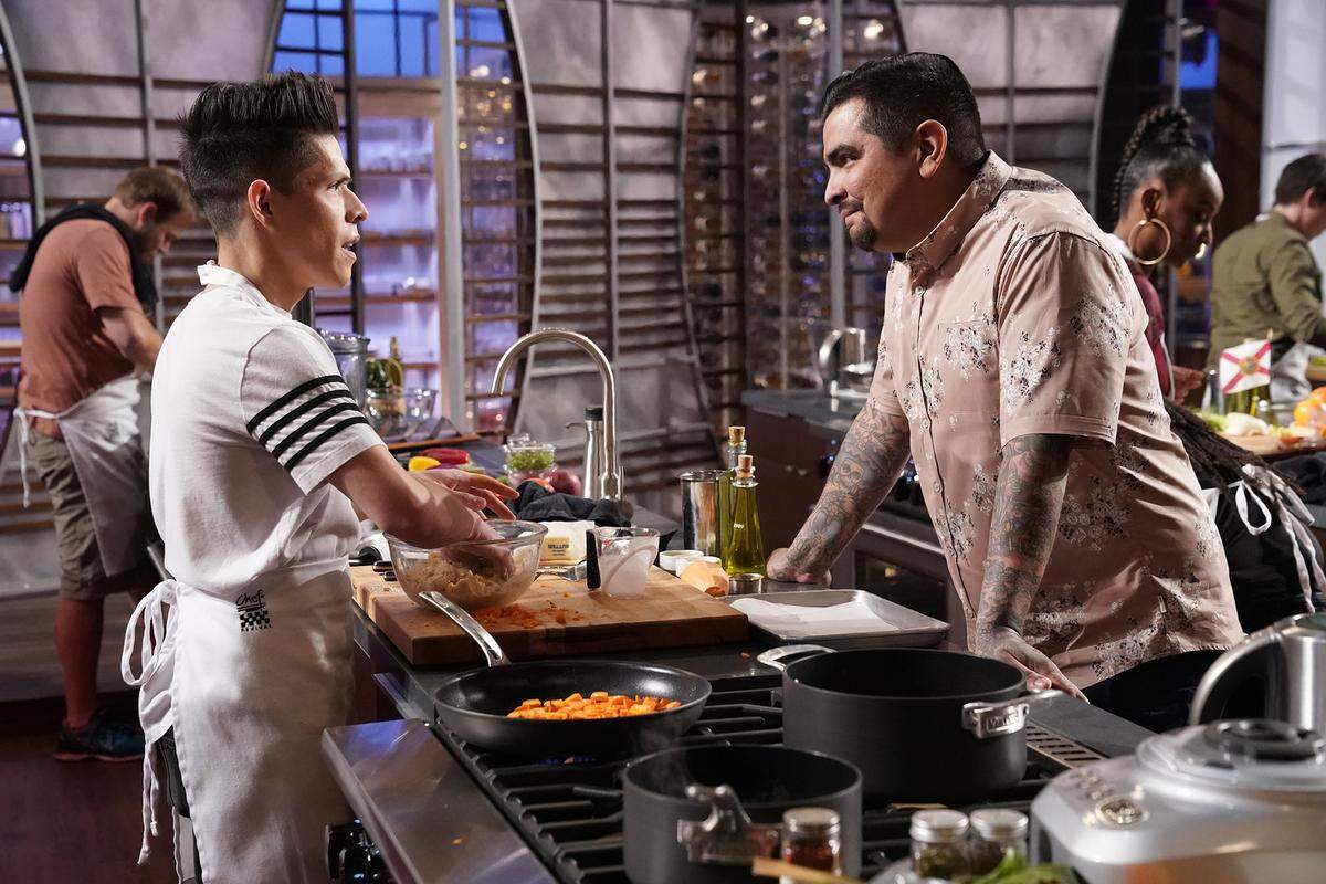 Juni Cuevas, left, with judge Aaron Sanchez on "MasterChef" episode airing June 6, 2018.