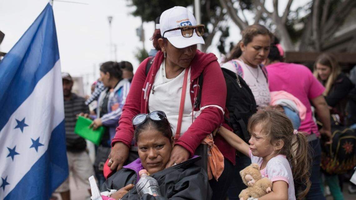 Members of a Central American family traveling with a caravan of migrants prepare to cross the border and apply for asylum in the United States, in Tijuana, Mexico, Sunday, April 29, 2018. The family journeyed in a caravan to the U.S. border to  ask for asylum but were told by U.S. immigration officials that the San Diego crossing was already at capacity. At a recent meeting at the White House with Donald Trump, sheriffs from across the country launched a crowdfunding site to help raise money for a wall at the U.S.-Mexico border.