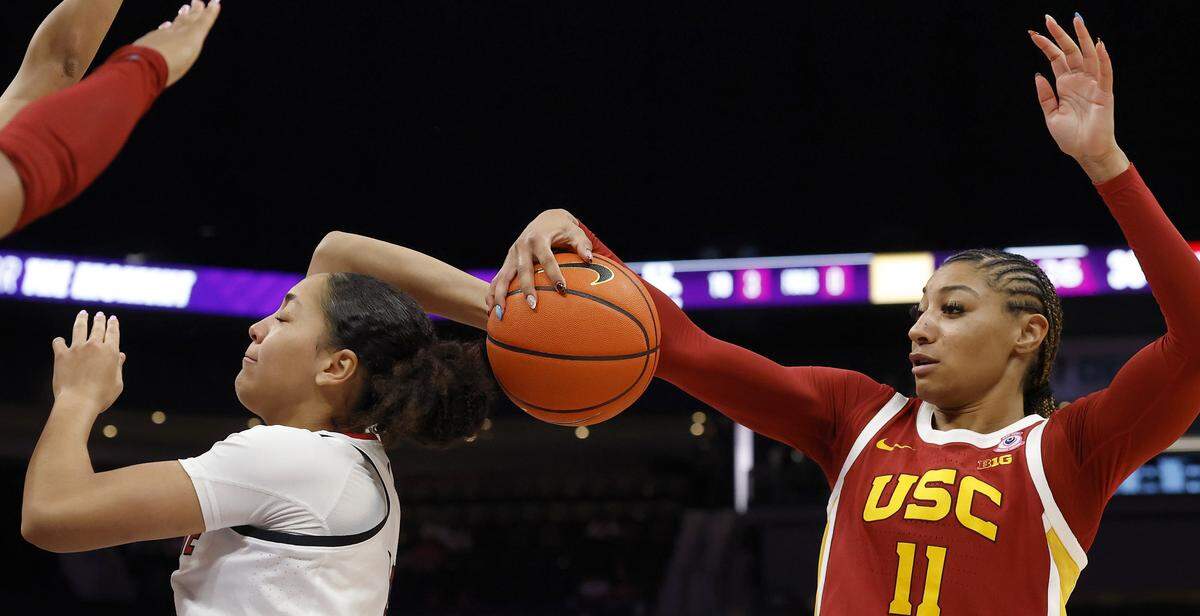 Southern California’s Kennedy Smith defends N.C. State’s Khamil Pierre during the second half of the Wolfpack’s 69-68 loss in the Ally Tipoff game on Sunday, Nov. 9, 2025, at Spectrum Center in Charlotte, N.C.