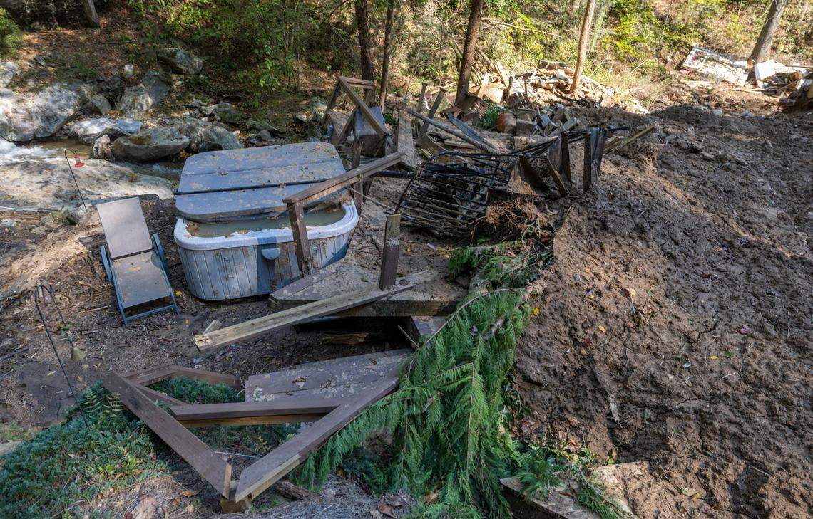 A hot tub and lounge chair remain untouched after a landslide destroyed the adjacent home on US 176 between Saluda and Tryon, N.C., photographed on Monday, October 7, 2024. A Polk County spokeswoman confirmed the death of a woman who lived in the structure.