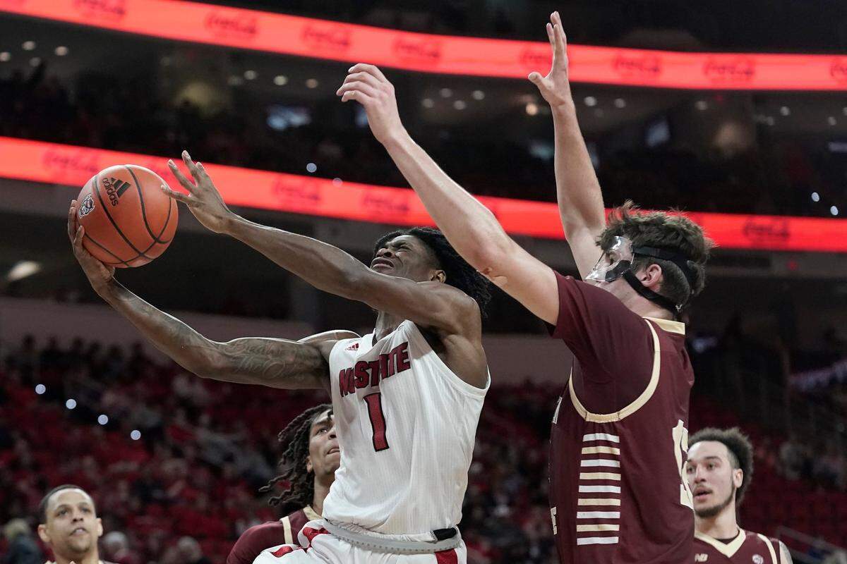 North Carolina State guard Dereon Seabron (1) drives to the basket against Boston College forward Quinten Post during the second half of an NCAA college basketball game in Raleigh, N.C., Wednesday, Feb. 23, 2022.