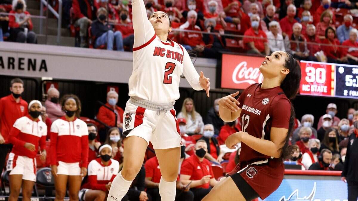 N.C. State’s Raina Perez (2) shoots as South Carolina’s Brea Beal (12) watches during the second half of South Carolinas 66-57 victory over N.C. State at Reynolds Coliseum in Raleigh, N.C., Tuesday, November 9, 2021.