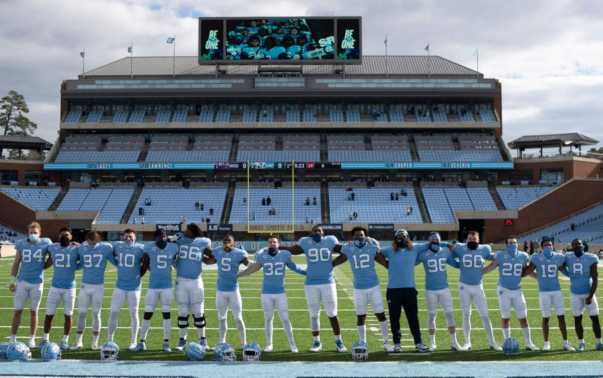 Sixteen members of the North Carolina football team are recognized before playing their final home game in Kenan Stadium on Saturday, December 5, 2020 in Chapel Hill, N.C.