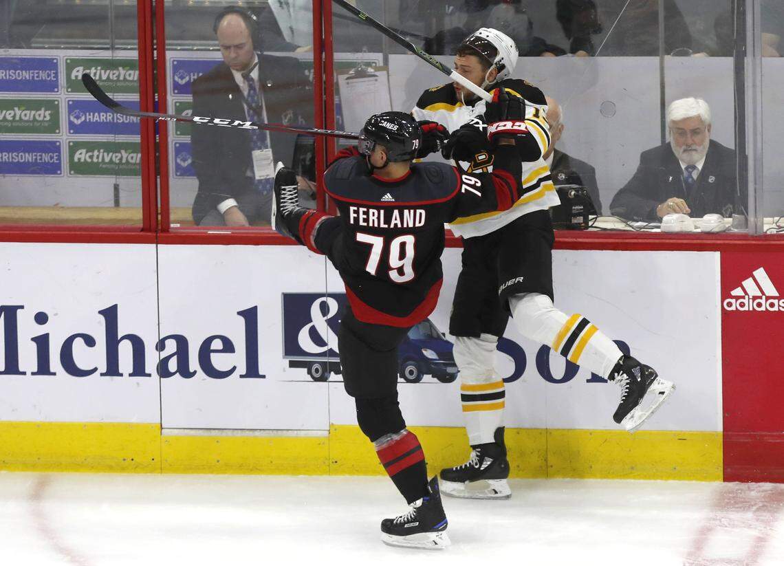 Carolina’s Micheal Ferland (79) checks Boston’s Charlie Coyle (13) during the first period of the Carolina Hurricanes’ game against the Boston Bruins in game three of the Eastern Conference finals at PNC Arena in Raleigh, N.C. Tuesday, May 14, 2019.
