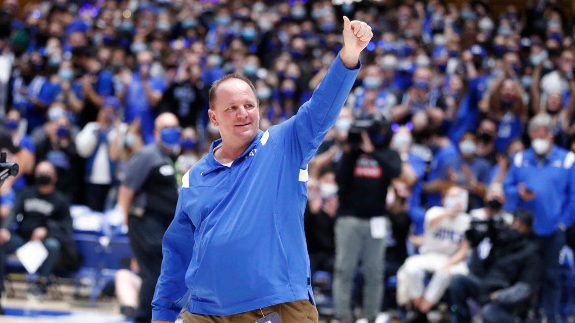 New Duke football coach Mike Elko acknowledges the crowd as he is introduced during Duke basketball game against S.C. State at Cameron Indoor Stadium in Durham, N.C., Tuesday, December 14, 2021.