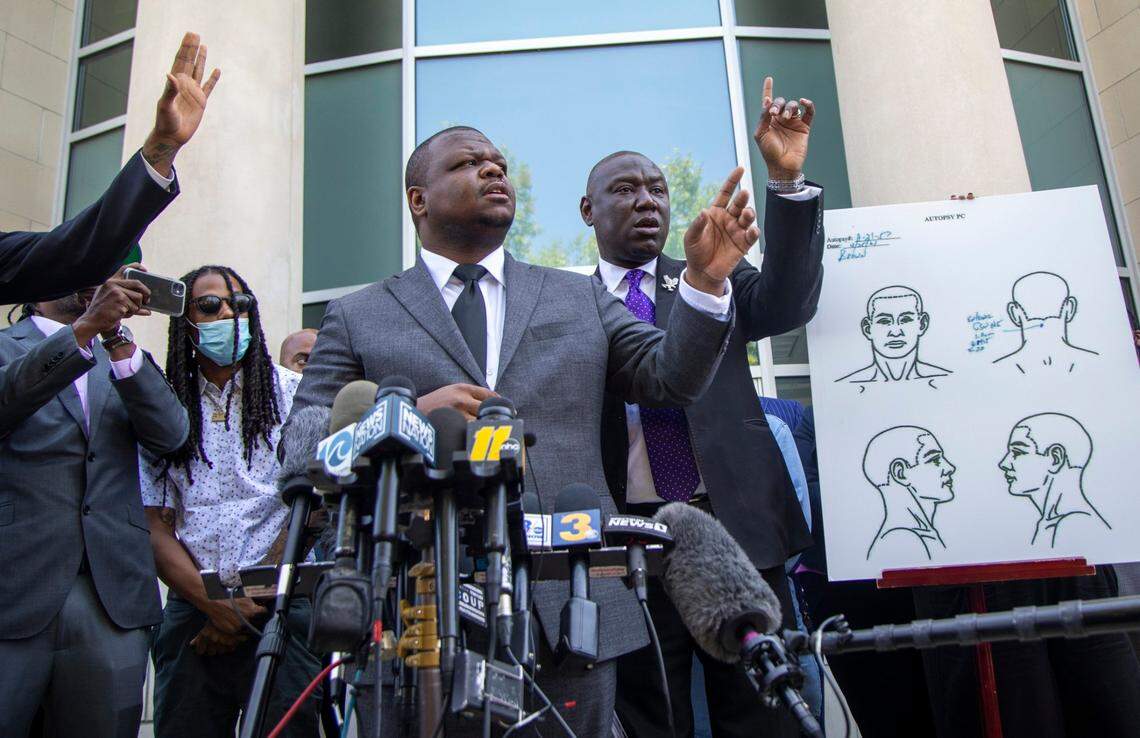 Attorneys for the family of Andrew Brown Jr., including Harry Daniels, center, and Ben Crump take questions from reporters during a press conference outside the Pasquotank County Public Safety building Tuesday, April 27, 2021 to announce results of the autopsy they commissioned, which they said showed five bullet wounds including one to the back of the head. They accused Pasquotank County officials of hiding information and keeping justice from being served in Elizabeth City.