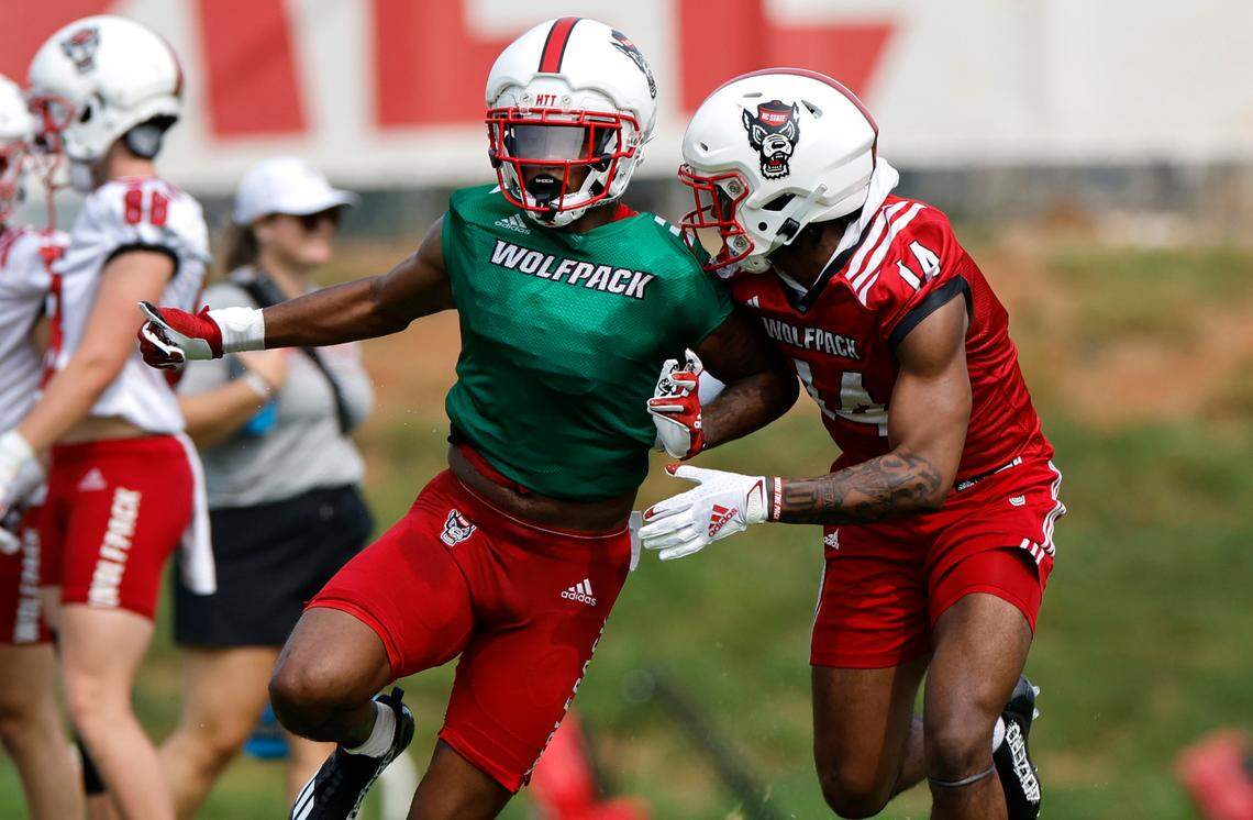 N.C. State cornerback Renté Hinton (14) defends wide receiver DJ Collins (86) during the Wolfpack’s first fall practice in Raleigh, N.C., Wednesday, August 2, 2023.
