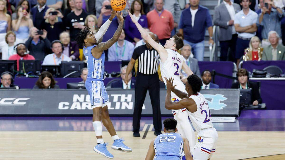North Carolina’s Caleb Love (2) tries to hit a three-pointer as time runs out in Kansas’ 72-69 victory over UNC in the NCAA Men’s National Championship at the Caesars Superdome in New Orleans, La., Monday, April 4, 2022.