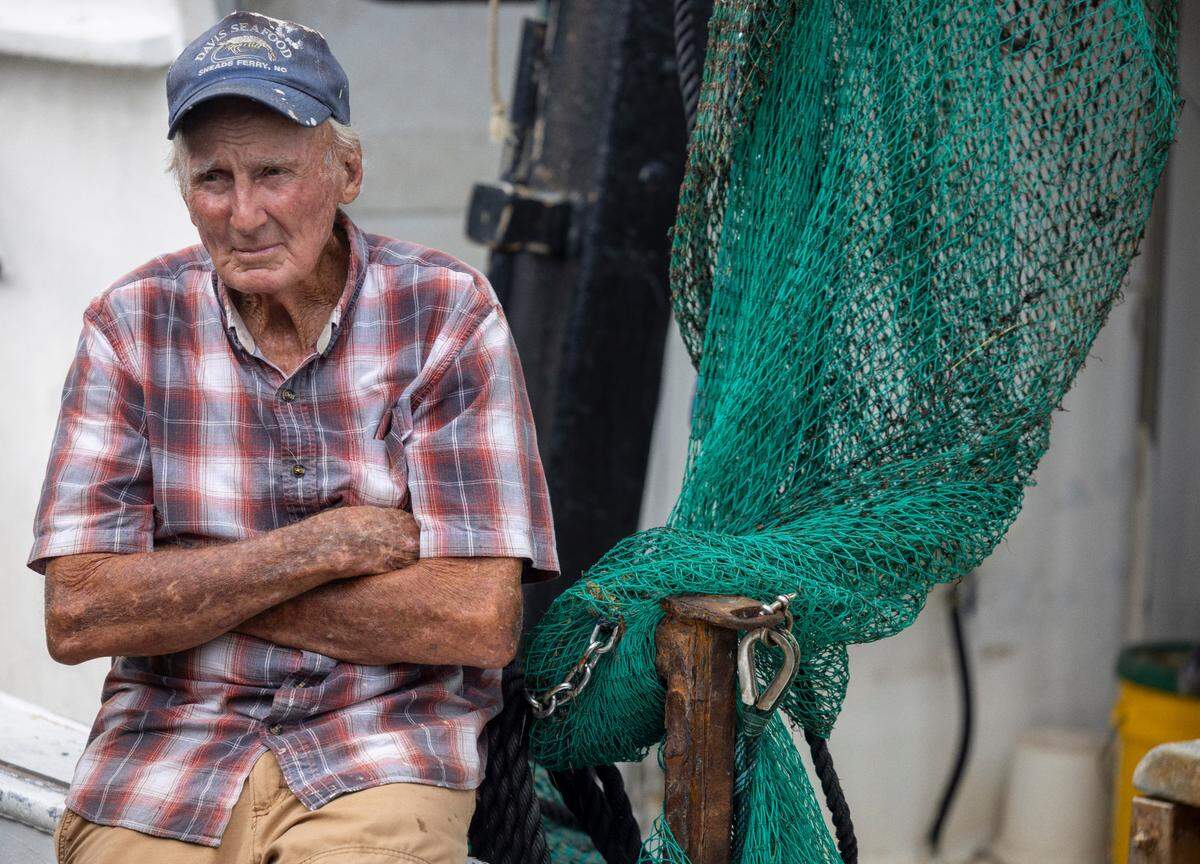 William “Buddy” Davis waits for the arrival of the shrimper the Captain Davis, to begin processing some of the 10,000 pounds of fresh caught shrimp on Wednesday, July 16, 2025 in Sneads Ferry, N.C.