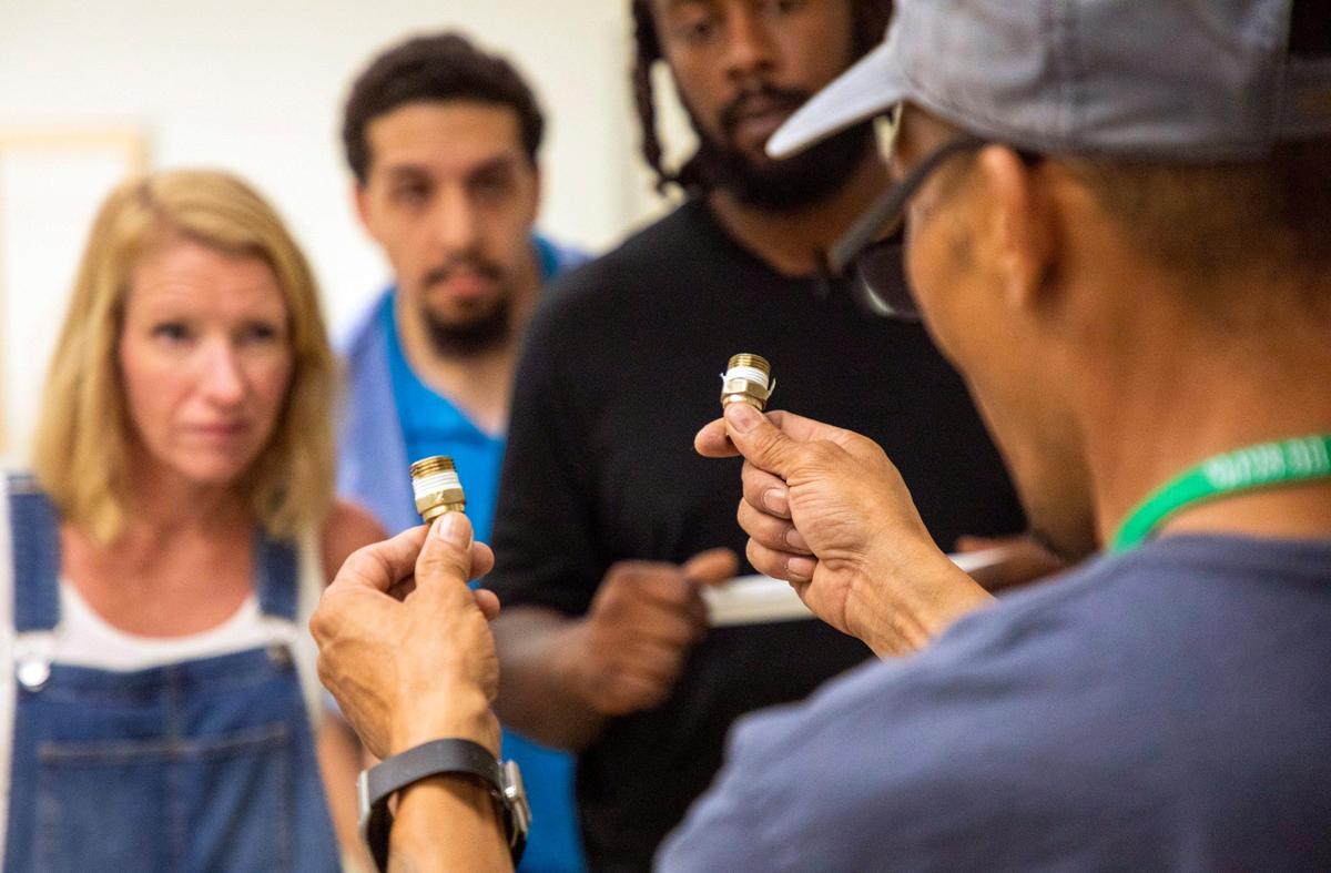 Robert Brewer, right, teaches students in his plumbing class at Durham Technical Community College on Thursday, Aug. 30, 2019, in Durham, NC.