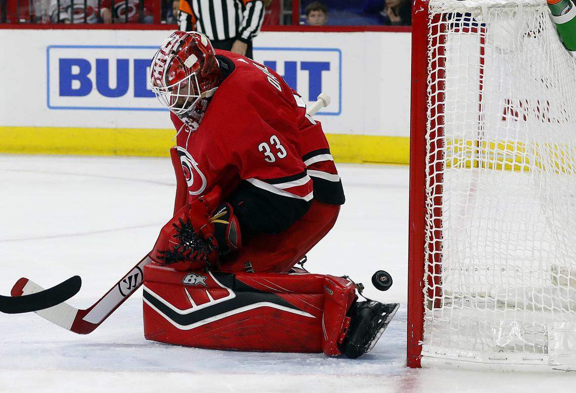 Carolina Hurricanes goaltender Scott Darling (33) has the puck slip past for a goal by the Columbus Blue Jackets during the first period of an NHL hockey game, Saturday, Nov. 17, 2018, in Raleigh.