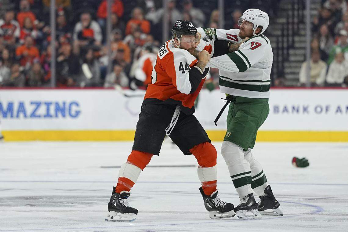 Nicolas Deslauriers, left, of the Philadelphia Flyers fights Marcus Foligno of the Minnesota Wild in the first period at Xfinity Mobile Arena on Oct. 18, 2025 in Philadelphia, Pennsylvania.