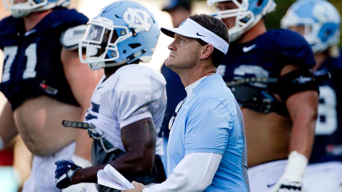 North Carolina defensive coordinator Gene Chizik works with his players during practice on Tuesday, September 6, 2016 at Navy Field in Chapel Hill, N.C. Chizik said the Tar Heels’ run defense needs to improve as they prepare for their next game against Illinois.