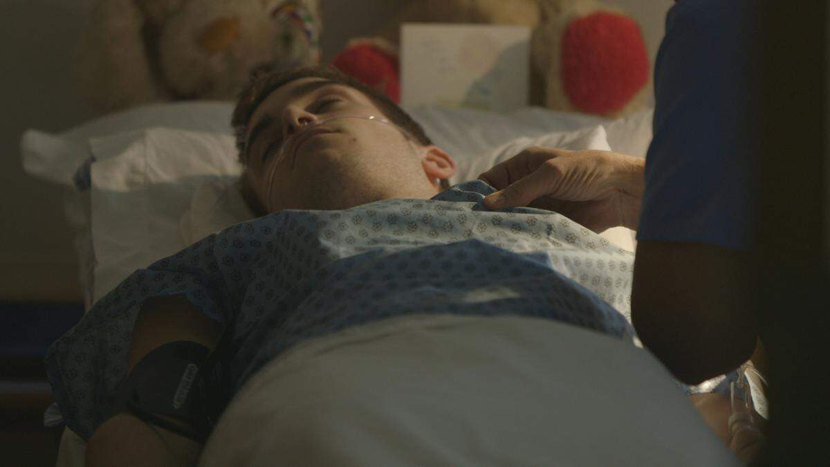 In a reenactment in the Investigation Discovery series “Fatal Passions,”  an actor portraying Eric Miller of Raleigh lies in a hospital bed after being poisoned.