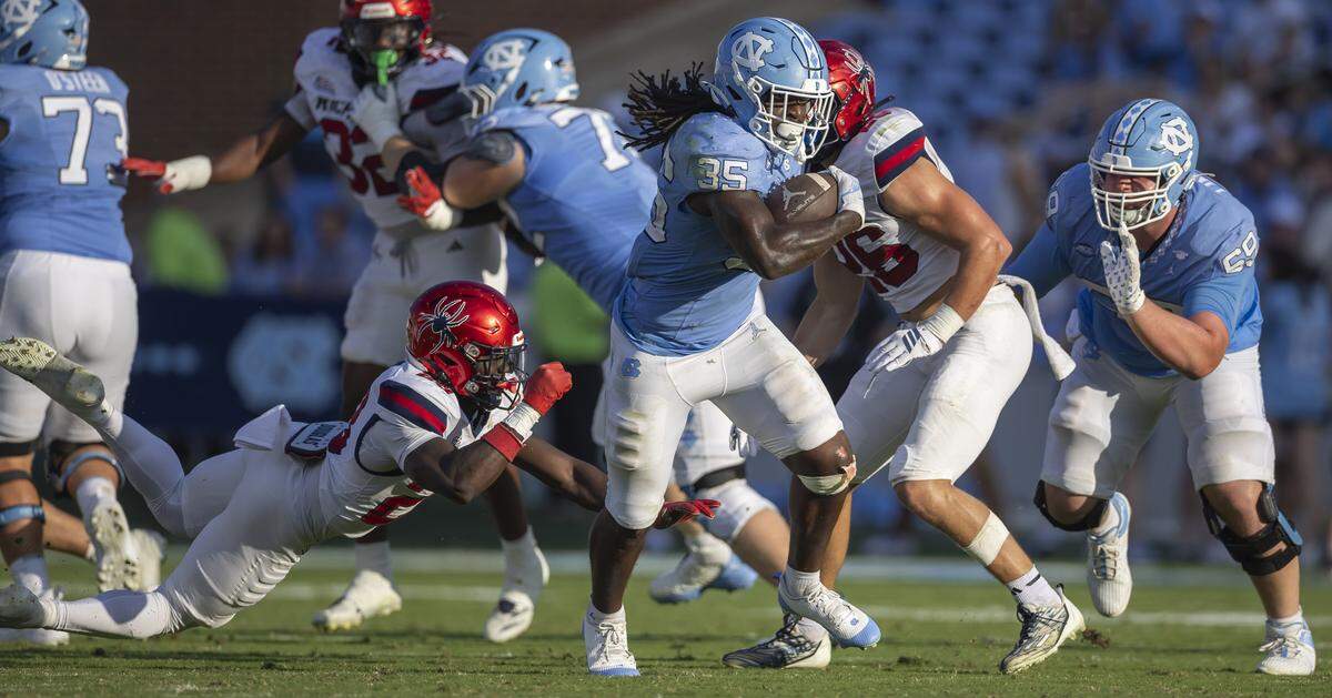 North Carolina running back Demon June (35) breaks away from Richmond’s Amir Haskett (23) for a 45-yard touchdown run in the fourth quarter to give the Tar Heels a 41-3 lead on Saturday, September 13, 2025 at Kenan Stadium in Chapel Hill, N.C.