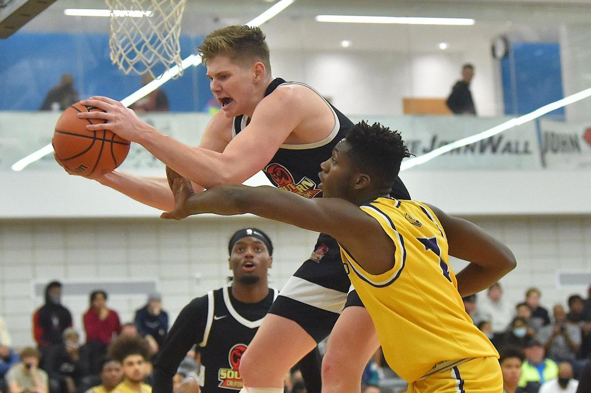 Word of God’s Jamal Brown (7) challenges Southern California’s Jaxon Kohler (0) for the rebound in the second half. The Word of God Holy Rams and the Southern California Academy Rams met in the John Wall Holiday Classic in Raleigh, N.C. on December 30, 2021