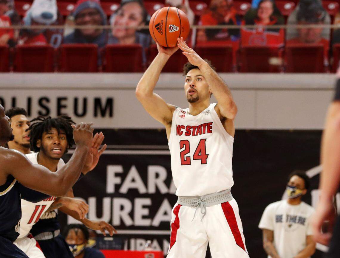 N.C. State’s Devon Daniels (24) shoots during N.C. State’s game against Charleston Southern in the Wolfpack Invitational at Reynolds Coliseum in Raleigh, N.C., Wednesday, Nov. 25, 2020.