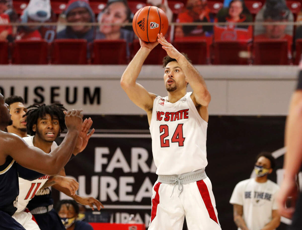 N.C. State’s Devon Daniels (24) shoots during N.C. State’s game against Charleston Southern in the Wolfpack Invitational at Reynolds Coliseum in Raleigh, N.C., Wednesday, Nov. 25, 2020.