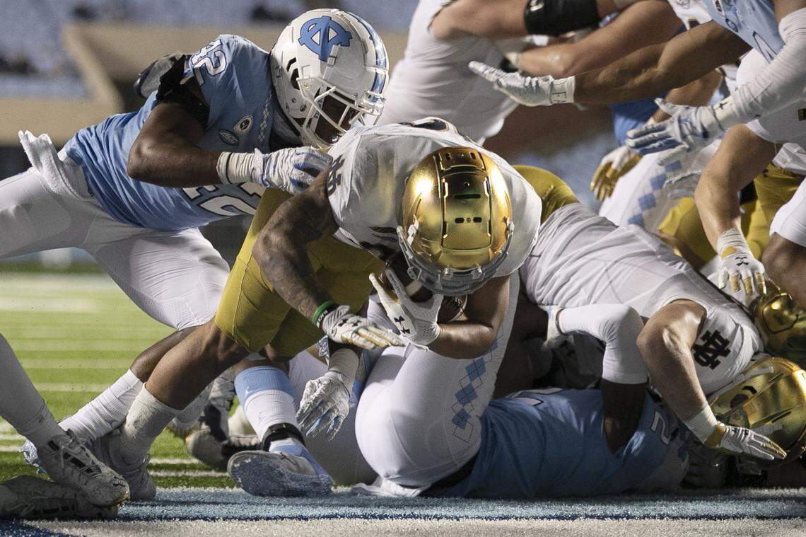 Notre Dame’s Kyren Williams (23) scores on a one-yard carry to secure Notre Dame’s 31-17 victory over North Carolina on Friday, November 27, 2020 at Kenan Stadium in Chapel Hill, N.C.