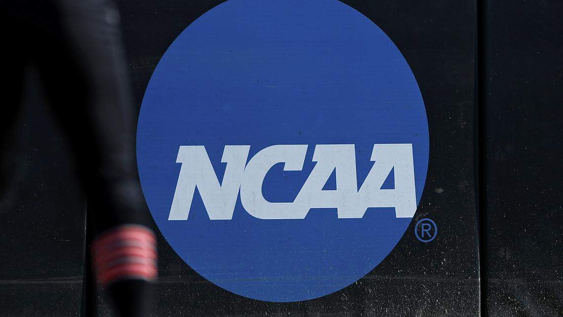 An athlete stands near the NCAA logo during a softball game in Beaumont, Texas, April 19, 2019.