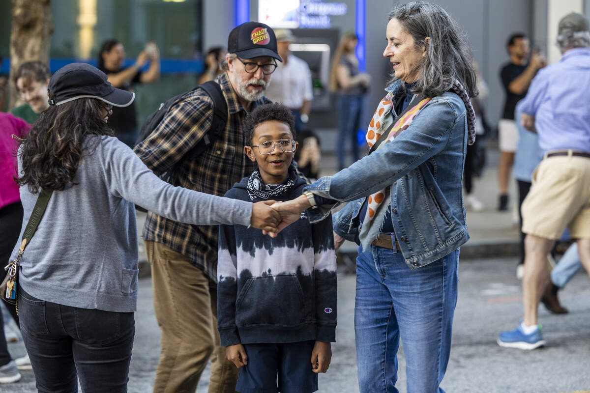 Festival-goers square dance on Martin Street during the Raleigh Wide Open music festival in downtown Raleigh on Friday, Oct. 3, 2025. The event features live bluegrass, folk, Americana and gospel artists.