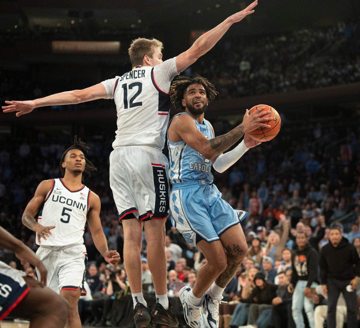 North Carolina’s R.J. Davis (4) drives to the basket against Connecticut’s Cam Spencer (12) during the second half in the Jimmy V Classic on Tuesday, December 5, 2023 at Madison Square Garden in New York, NY.