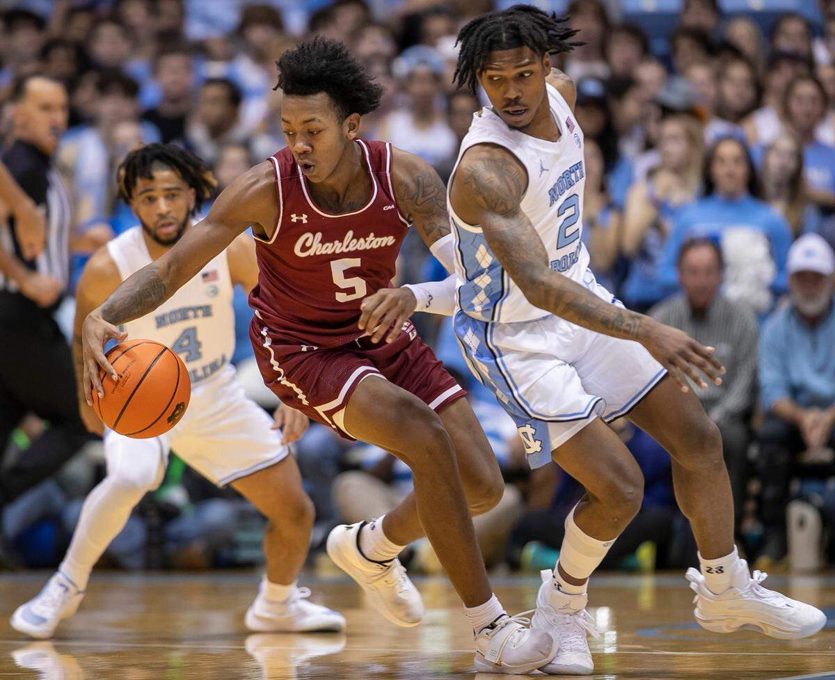 North Carolina’s Caleb Love (2) forces a turnover by College of Charleston’s Raekwon Horton (5) during the first half on Friday, November 11, 2022 at the Smith Center in Chapel Hill, N.C.