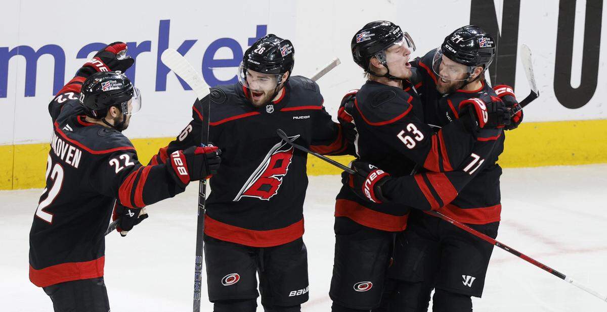 Carolina's Jackson Blake (53) celebrates with Taylor Hall (71) as Sean Walker (26) celebrates with Logan Stankoven (22) after Blake scored in the second period of the Hurricanes’ game against the Canadiens in game five of the Eastern Conference Finals at the Lenovo Center Friday, May 29, 2026.