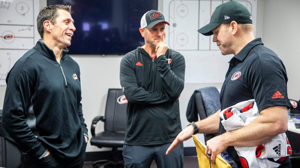 Emergency goalie Dave Ayres, 42, right, talks with Carolina Hurricanes coach Rod Brind’Amour, left, and owner Tom Dundon Tuesday, Feb. 25, 2020 while visiting Raleigh after helping the Hurricanes beat the Maple Leafs in Toronto.