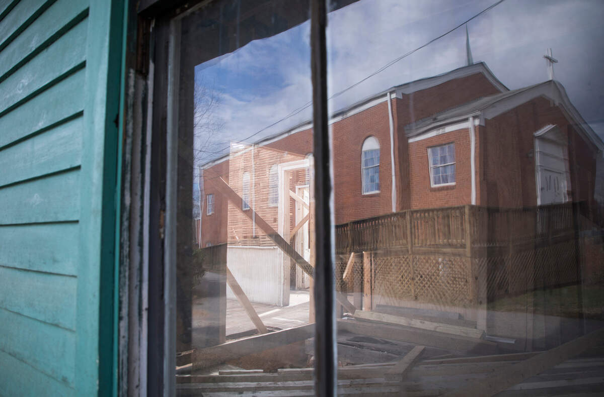 Oberlin Baptist Church seen in the reflection of The Graves-Fields house.