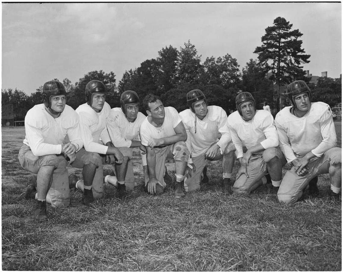 Future Alabama coach Paul “Bear” Bryant, center, coaching a team at the UNC Pre-Flight School during World War II.