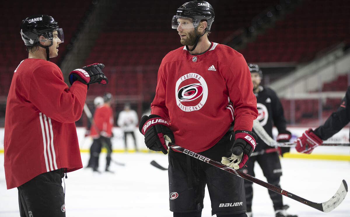 Carolina Hurricanes’ Sebastian Aho (20) talks with Jordan Staal (11) during practice on Monday, May 6, 2019 at PNC Arena in Raleigh, N.C.