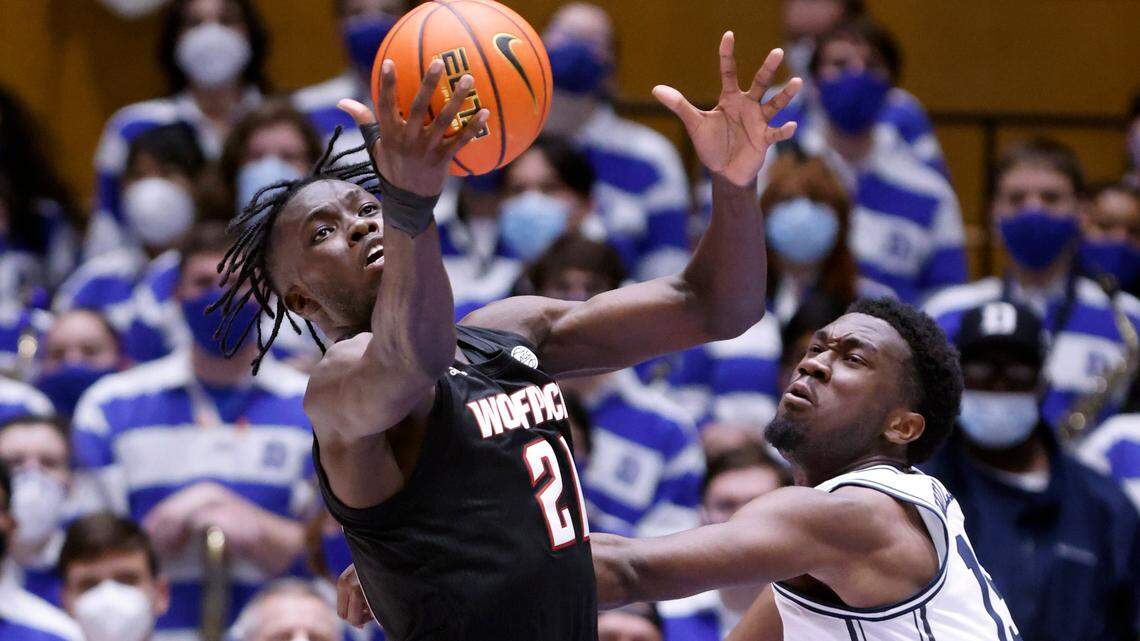 N.C. State’s Ebenezer Dowuona (21) pulls in the rebound from Duke’s Mark Williams (15) during the second half of Duke’s 88-73 victory over N.C. State at Cameron Indoor Stadium in Durham, N.C., Saturday, January 15, 2022.
