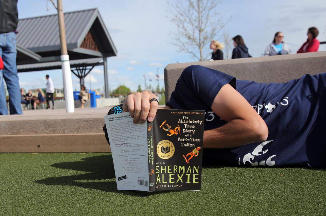 An Idaho high school student reads “The Absolutely True Diary of a Part-Time Indian” by Sherman Alexie in this 2016 photo. An updated Wake County school policy would require teachers to discuss with other school staff before they read aloud excerpts from books in class.