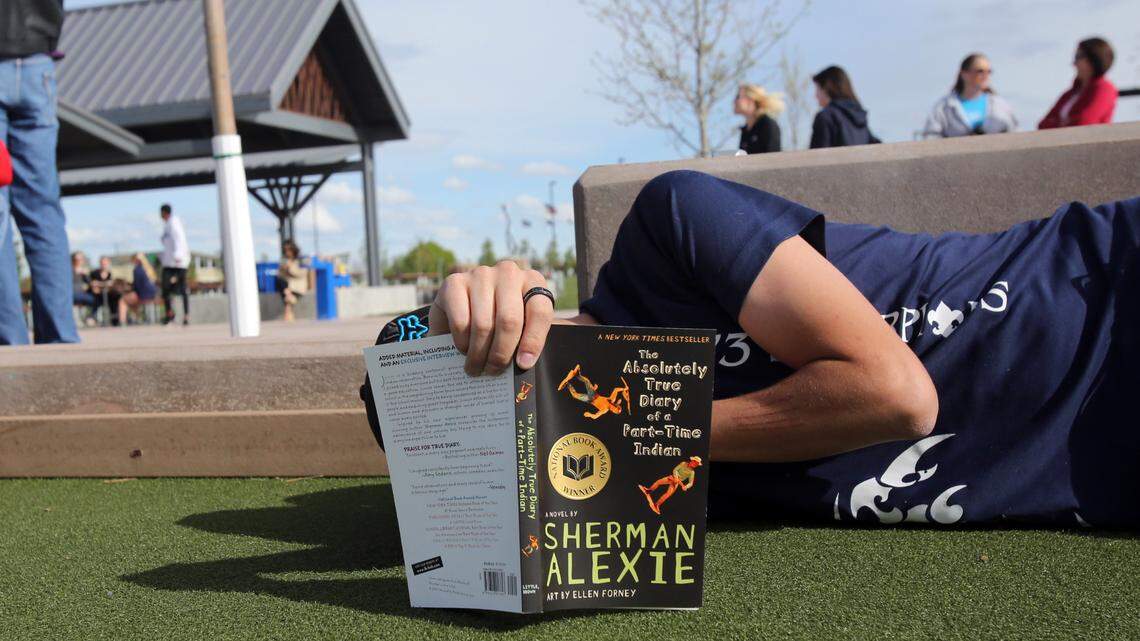 An Idaho high school student reads “The Absolutely True Diary of a Part-Time Indian” by Sherman Alexie in this 2016 photo. An updated Wake County school policy would require teachers to discuss with other school staff before they read aloud excerpts from Alexie’s book in their classrooms.