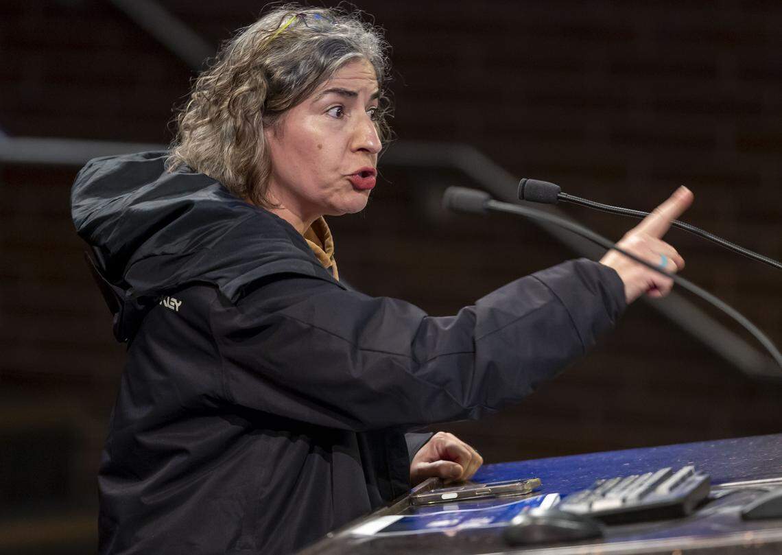 Emanuela Prister points to Cary Mayor Harold Weinbrecht during a public hearing on Jan. 8. Prister said she was disappointed with the mayor and the actions of former town manager Sean Stegall.