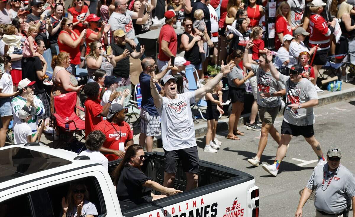 The Hurricanes coach Rod Brind’Amour acknowledges the crowds during a parade and rally for the Carolina Hurricanes in downtown Raleigh Saturday, June 20, 2026.
